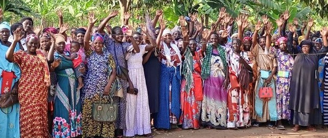 Members of a savings group waving